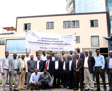 Members of a workshop posing in front of a building in Ethiopia
