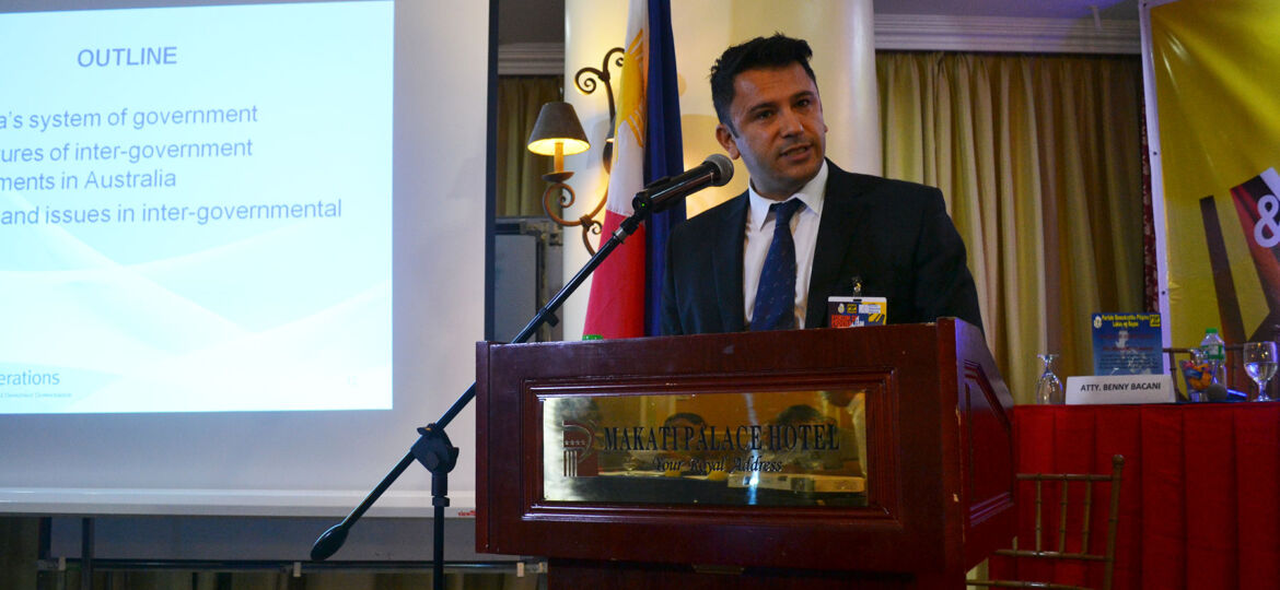 Man speaks at podium in the Philippines