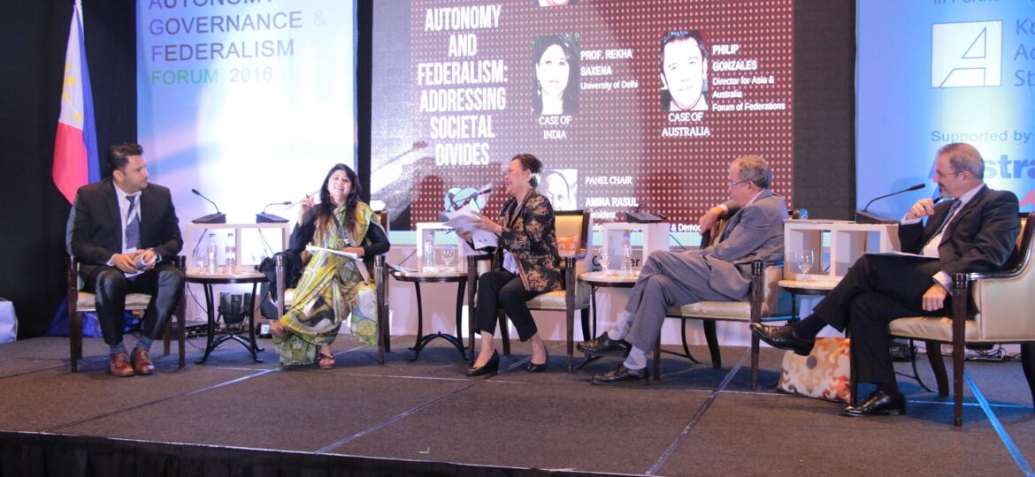 Panel discussion on stage at the Global Autonomy and Governance Forum