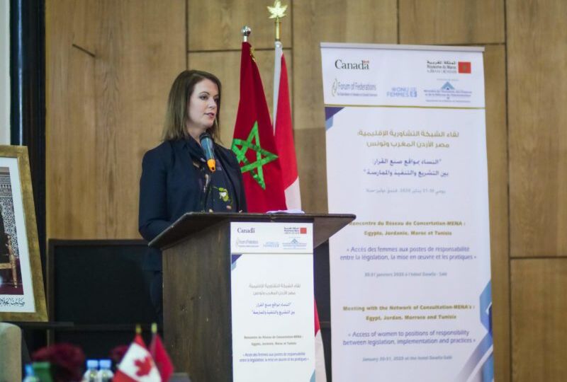 Woman giving speech at podium in Morocco