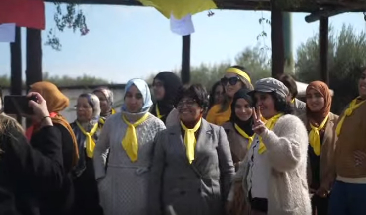 Group of women wearing yellow scarves